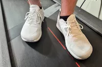 A close-up of two feet wearing the Altra Men's Solstice XT 3 on a treadmill
