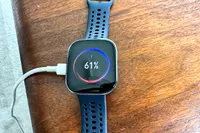 The Amazfit Bip 6 Smartwatch plugged in and charging