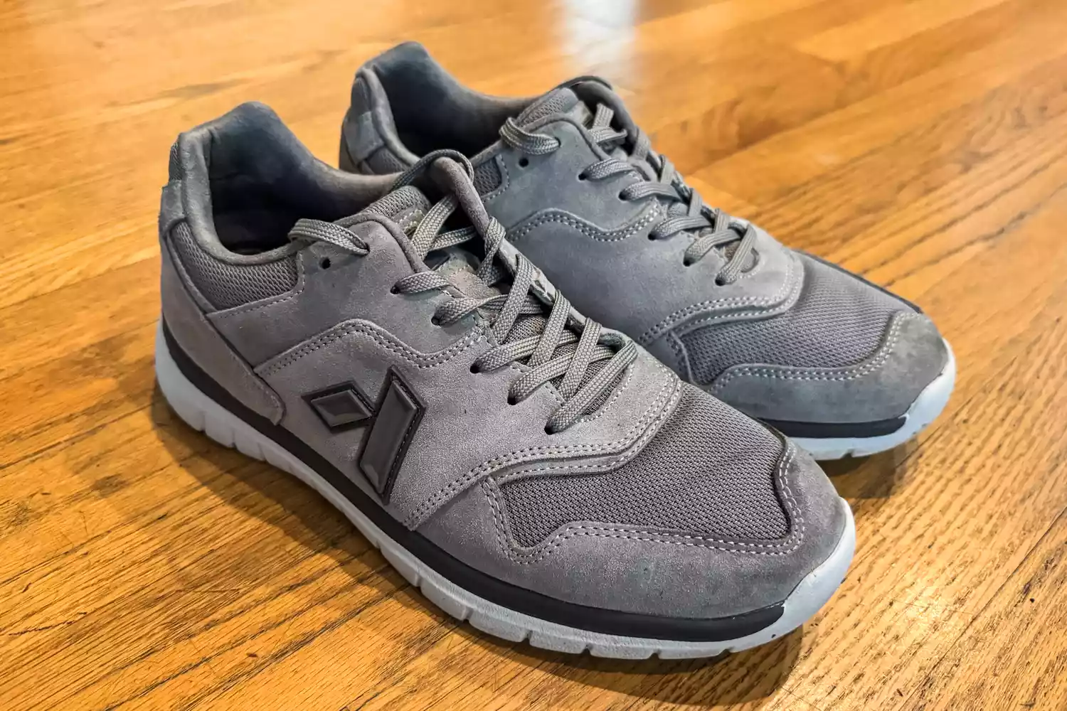 The Anodyne No. 50 Men's Sport Trainers on a wooden floor