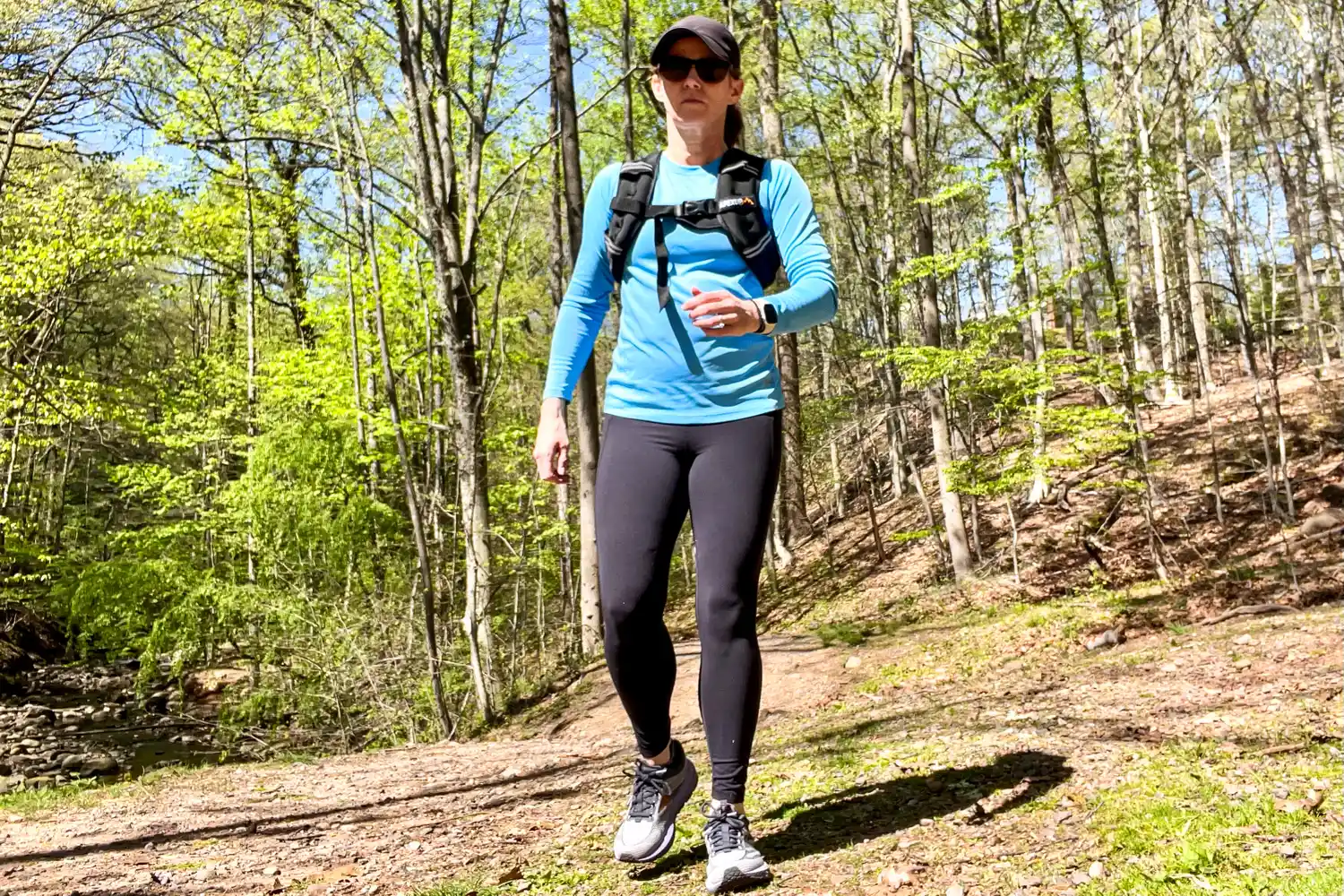 A person walks outside while wearing the APEXUP Weighted Vest