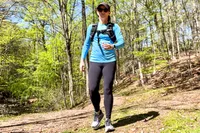 A person walks outside while wearing the APEXUP Weighted Vest