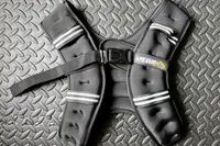 The APEXUP Weighted Vest on a gym floor