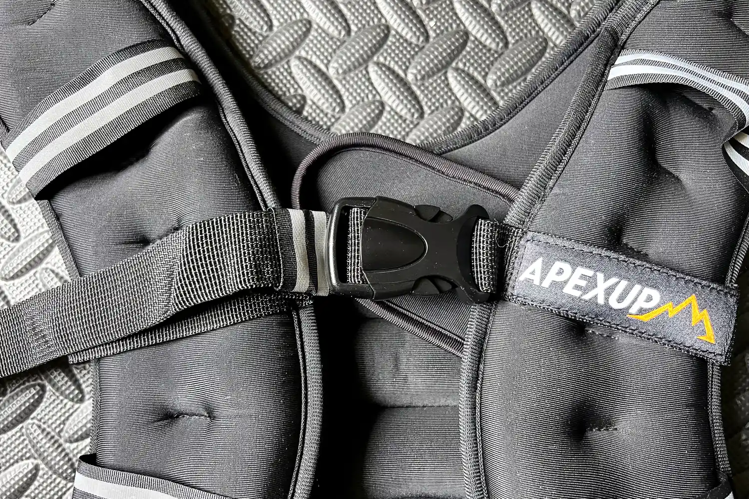 The buckle on the front of the APEXUP Weighted Vest