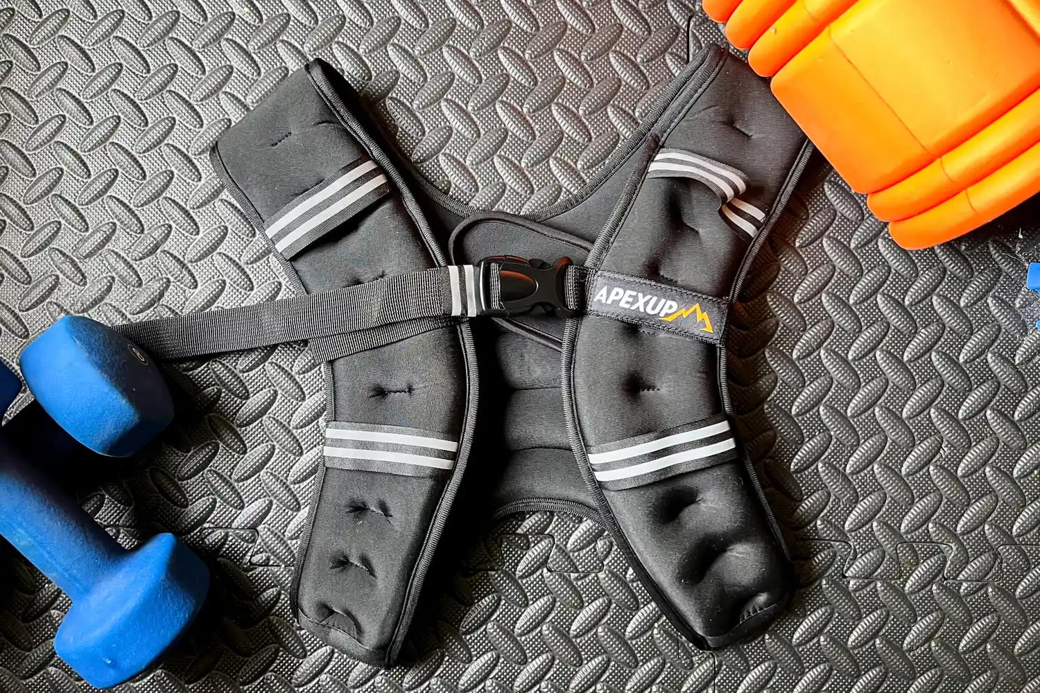 The APEXUP Weighted Vest on a gym floor 