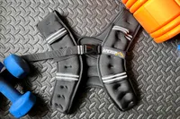 The APEXUP Weighted Vest on a gym floor 