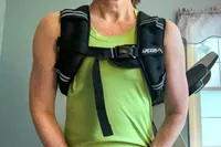 A person wears the APEXUP Weighted Vest