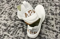 The APL Men's TechLoom Travelers on carpet