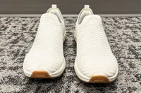 A front view of a person wearing the APL Men's TechLoom Travelers