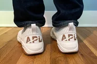 The brand name on the back of the APL Men's TechLoom Travelers