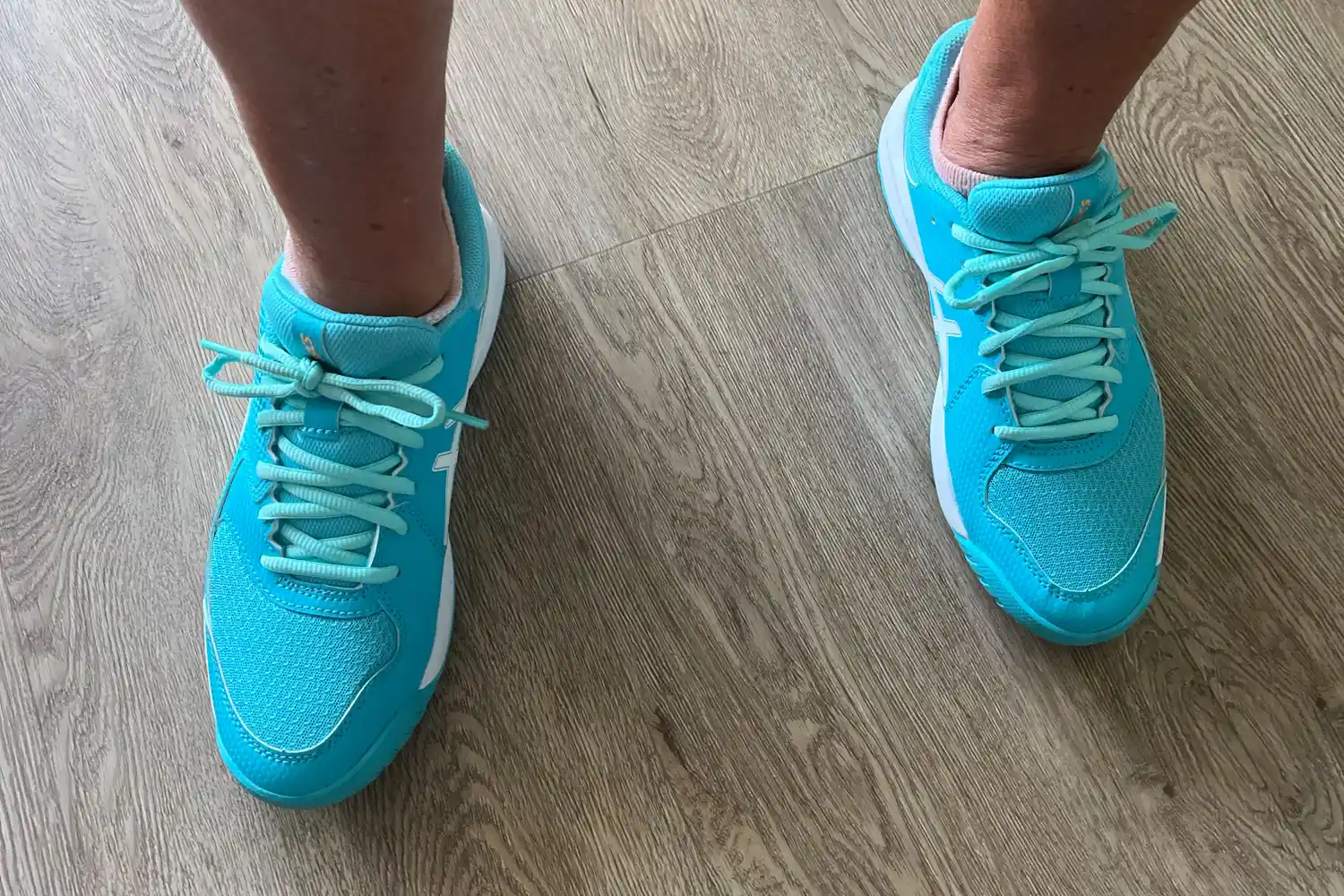 An overhead view of a person wearing the Asics Women's Gel-Dedicate 8 Pickleball Shoes