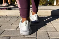 The back of a person wearing the Asics Women's Gel-Kayano 31 Running Shoes