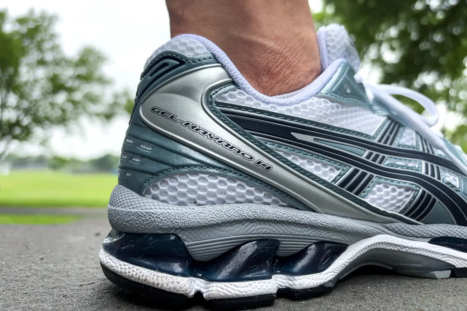 The name printed on the side of the Asics Men's Gel-Kayano 14 Sneakers