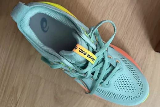 Closer view of Asics Gel-Kayano 31 placed on wooden floor