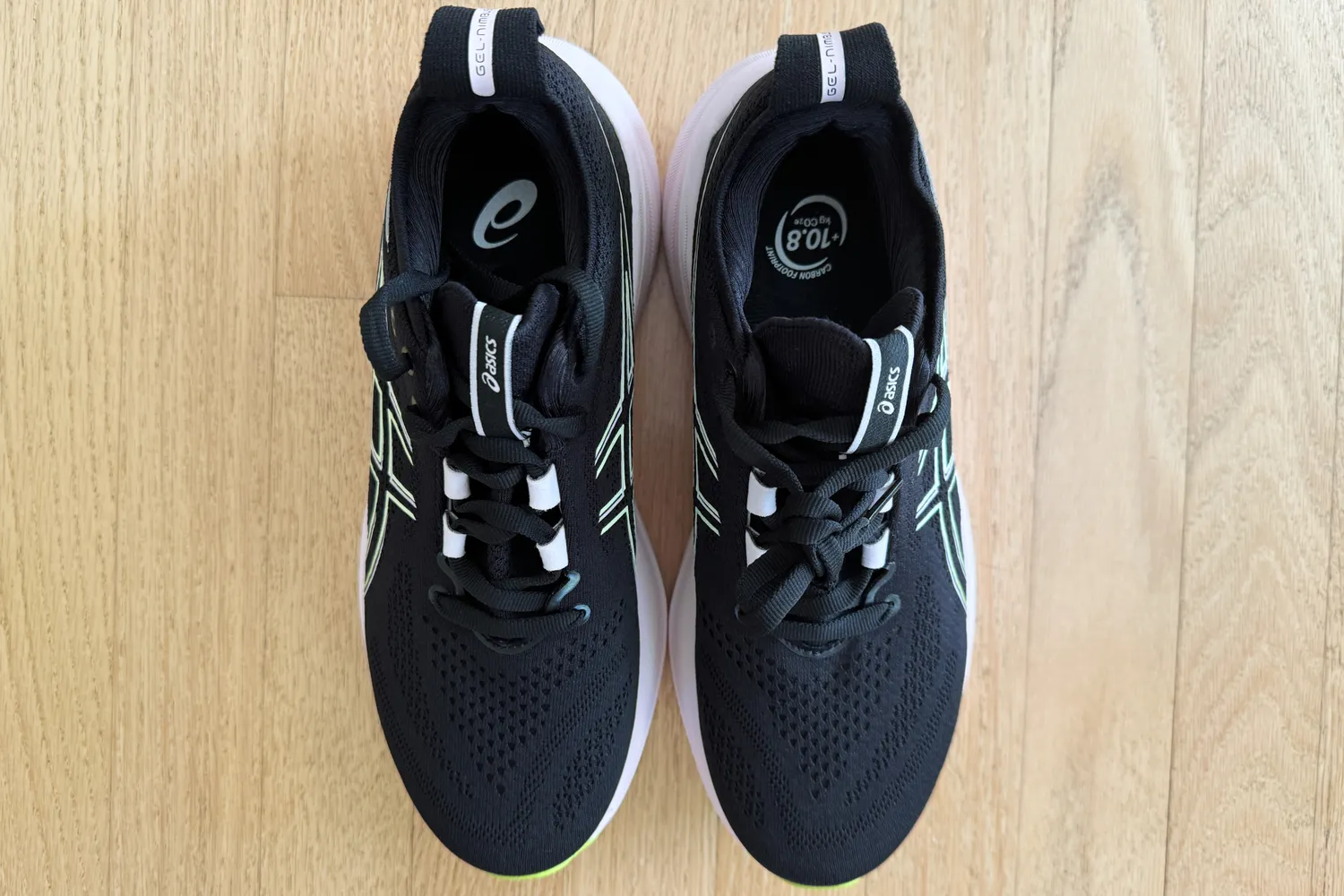 Asics Women's Gel-Nimbus 26 placed on wooden floor