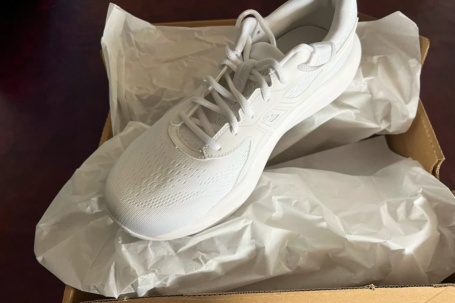 The Asics Women's Gel-Contend 9 Walking Shoes in a shoe box