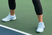 A person wears the Asics Women's Game FF Pickleball Shoes while playing pickleball
