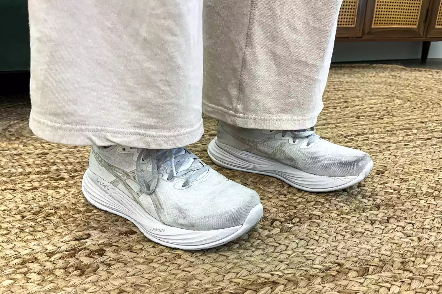 A person wears the Asics Women's Gel-Cumulus 27 Running Shoes inside