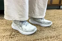 A person wears the Asics Women's Gel-Cumulus 27 Running Shoes inside