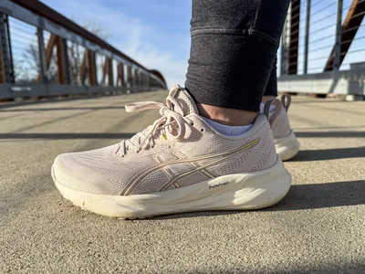 The Asics Women's GEL-Pulse 16 worn on a bridge viewed at a side angle