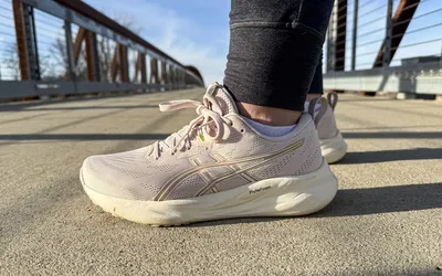 The Asics Women's GEL-Pulse 16 worn on a bridge viewed at a side angle