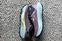 A pair of Asics Women's Gel-Trabuco 13 Trail Running Sneakers side by side on carpet