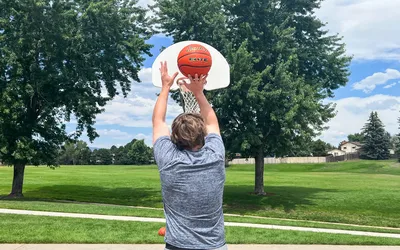 A person shoots the Baden Elite Game Basketball