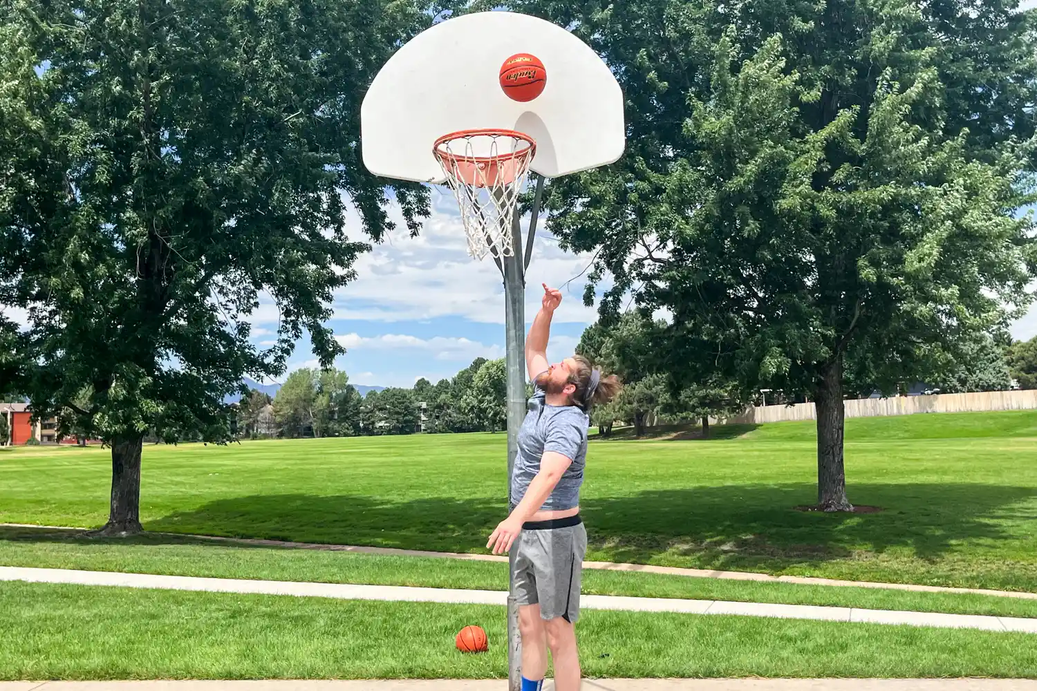 A person shoots the Baden Elite Game Basketball