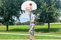 A person shoots the Baden Elite Game Basketball