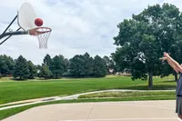 A person shoots the Baden Elite Game Basketball