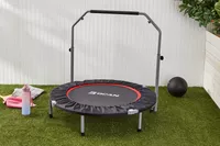 BCAN Foldable Mini Trampoline displayed on lawn next to ball and water bottle