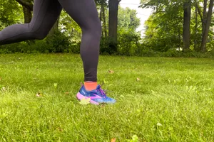 A close-up of a person running in Brooks Cascadia 17 shoes