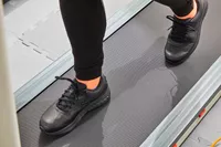Person walking on treadmill wearing Brooks Addiction Walker 2 Shoes
