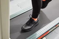 Person walking on treadmill wearing Brooks Addiction Walker 2 Shoes