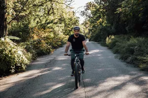 A person rides the Mongoose Colton Mens and Womens Mountain Bike