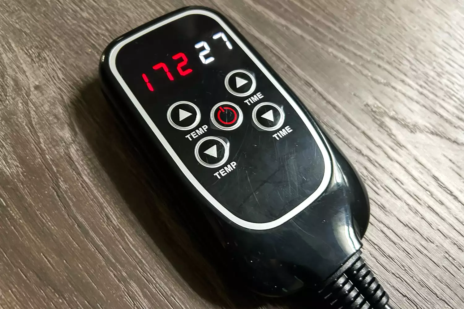 A close-up of the Bon Charge Infrared Sauna Blanket remote