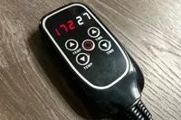 A close-up of the Bon Charge Infrared Sauna Blanket remote