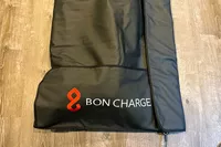 A close-up of the logo on the bottom of the Bon Charge Infrared Sauna Blanket