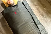 A close-up of a person using the Bon Charge Infrared Sauna Blanket