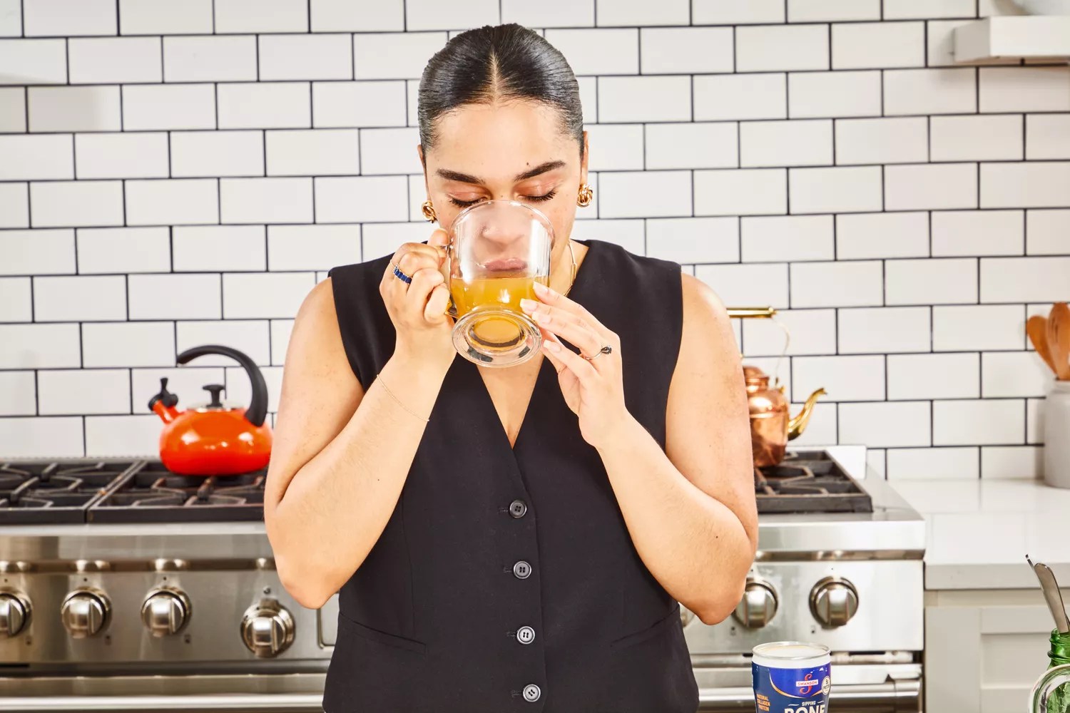 A person drinks Swanson Sipping Chicken Bone Broth