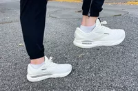 A person exercises while wearing the Brooks Men's Adrenaline GTS 24 Running Shoes