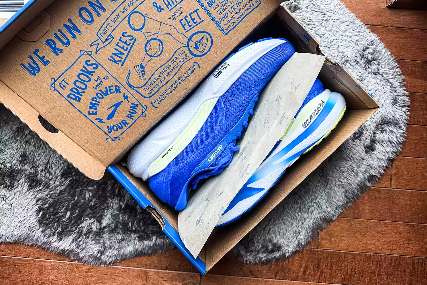 The Brooks Men's Adrenaline GTS 24 Road Running Shoes inside a shoebox