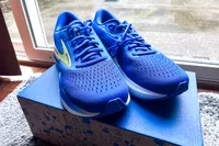 The Brooks Men's Adrenaline GTS 24 Road Running Shoes on top of a shoebox