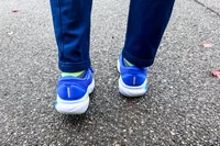 The back of a person wearing the Brooks Men's Adrenaline GTS 24 Road Running Shoes