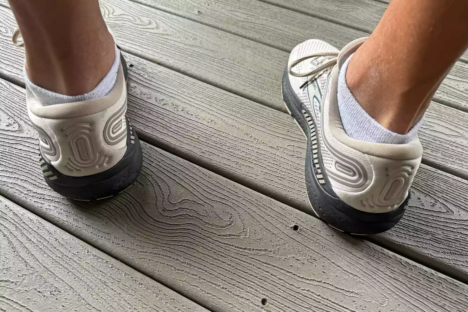 A person wears a pair of Brooks Men's Beast GTS 23 Running Shoes