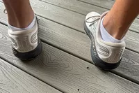 A person wears a pair of Brooks Men's Beast GTS 23 Running Shoes