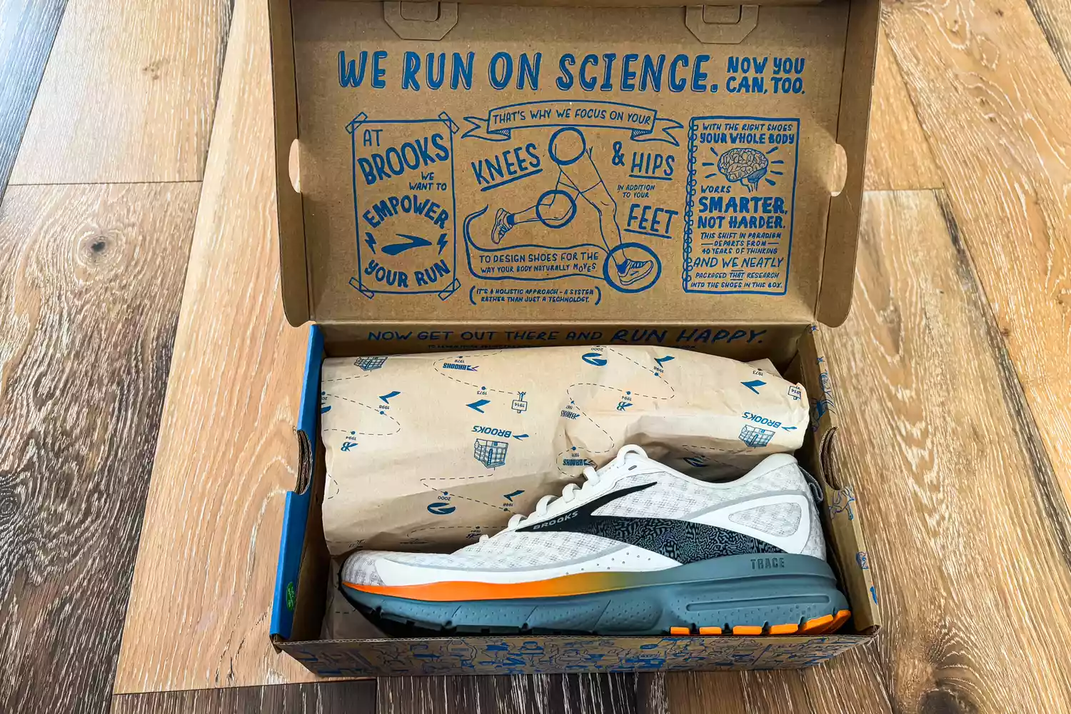 The Brooks Men's Trace 3 Road Running Shoes in a shoebox