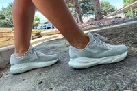 A person walking outdoors wearing Brooks Women's Adrenaline GTS 24 Running Shoes