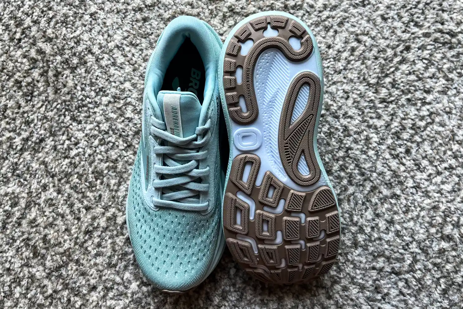 A pair of Brooks Women's Adrenaline GTS 24 Running Shoes on carpet