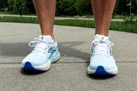 A person wearing Brooks Women's Glycerin GTS 22 Running Shoes on pavement