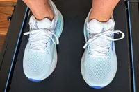 A person wearing Brooks Women's Glycerin GTS 22 Running Shoes on a treadmill